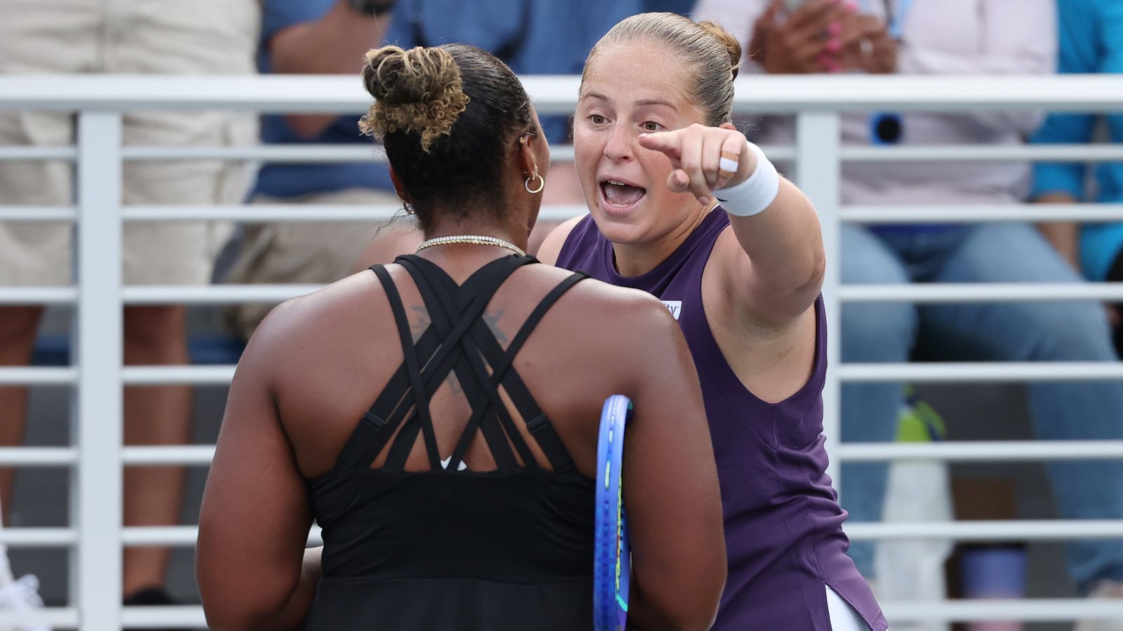 Jelena Ostapenko of Latvia (R) argues with Taylor Townsend of the United States (L) following their Women's Singles Second Round match on Da