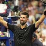 Novak Djokovic, of Serbia, celebrates after defeating Learner Tien, of the United States, during the first-round of the U.S. Open tennis cha