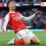 Gabriel Martinelli celebrates after scoring a late equaliser for Arsenal against Man City