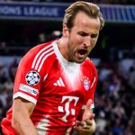 Harry Kane celebrates scoring against Chelsea in the Champions League