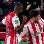 Brentford's Aaron Hickey celebrates after equalising against Aston Villa