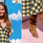 Chrissy Teigen wearing brown slouchy suede boots at the premiere of 'Gabby's Dollhouse: The Movie' on Saturday at the Grove in Los Angeles.