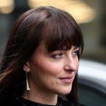 Dakota Johnson Capes up in Fall’s Chicest Outerwear Trend