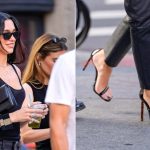 Dua Lipa wears Tom Ford patent leather double ankle strap sandals on Saturday.