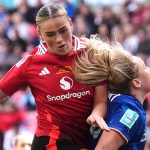 Grace Clinton directs a header at the Chelsea goal