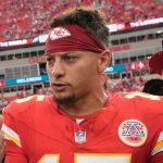 Kansas City Chiefs quarterback Patrick Mahomes (15) and Philadelphia Eagles quarterback Jalen Hurts shake hands following an NFL football game Sunday, Sept. 14, 2025, in Kansas City, Mo. (AP Photo/Charlie Riedel)