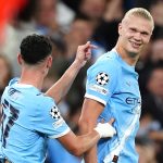 Erling Haaland celebrates with Phil Foden after putting Man City ahead against Napoli