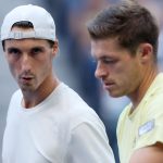 Neal Skupski of the United Kingdom (R) talks with partner Joe Salisbury of the United Kingdom against Yuki Bhambri of India and Michael Venu