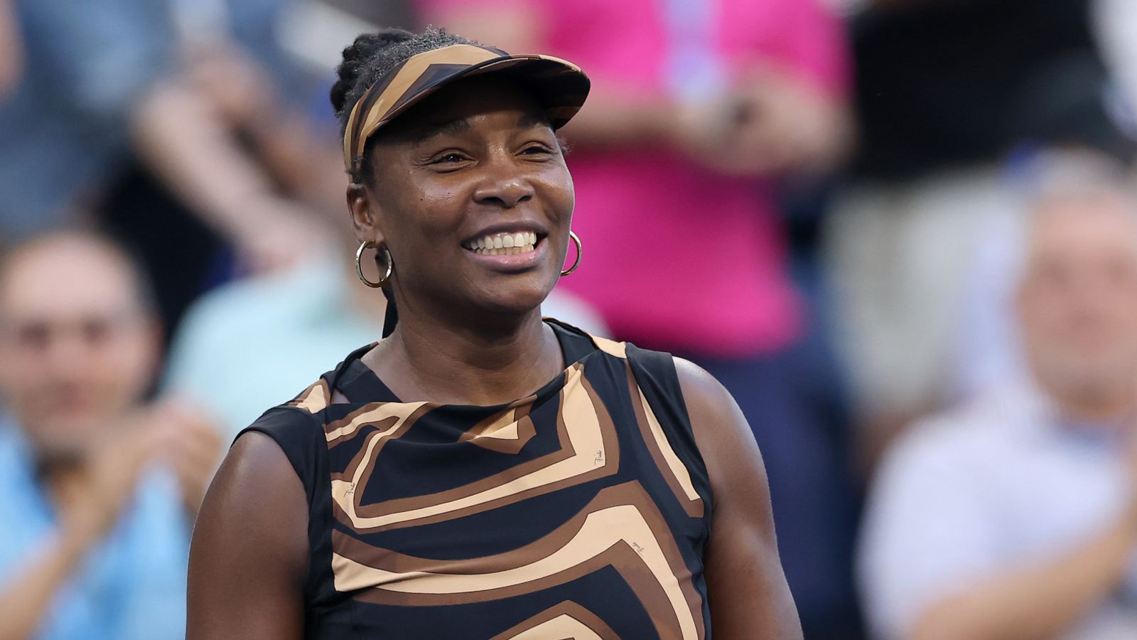 Venus Williams of the United States celebrates with partner Leylah Fernandez of Canada (not pictured) after defeating Shuai Zhang of China a