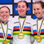 Anna Morris, Katie Archibald, Josie Knight, Megan Barker and Jessica Roberts smiling on the podium with gold medals around their necks