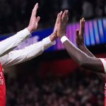 Arsenal's Bukayo Saka celebrates with Declan Rice after scoring the second goal against Olympiakos
