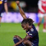 Dumornay celebrates scoring for Lyon against Arsenal