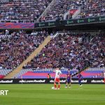 Ange Postecoglou holds his head