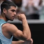 Carlos Alcaraz of Spain reacts after defeating Yoshihito Nishioka of Japan in their second round match at the Australian Open tennis championship in Melbourne, Australia, Wednesday, Jan. 15, 2025. (AP Photo/Ng Han Guan)