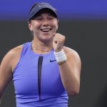 Amanda Anisimova, of the United States reacts after defeating Jasmine Paolini, of Italy in the women's singles quarterfinals match of the Ch