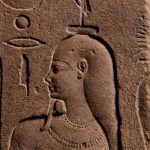 A rare Egyptian quartzite relief from the early Ptolemaic period, circa 332 BC. Once covered in varnish or wax, it now sparkles like gold.