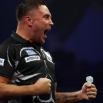 Gerwyn Price celebrates beating Josh Rock at the World Grand Prix of Darts