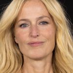 Gillian Anderson On Paris Fashion Week, Her Beauty Must-Have, & More