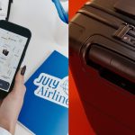 woman using the apple find my app to track her new july luggage; new july carry on suitcase in a brown shade over red background
