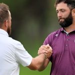 Shane Lowry and Jon Rahm shake hands after completing the second round in Madrid
