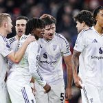 Manchester United players celebrate their win over Liverpool