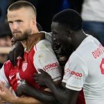 Monaco's Eric Dier celebrates with team-mates after he scored from the penalty spot against Man City