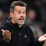Marco Silva gestures with both hands in front of his body during Fulham's match against Arsenal on October 18 at Craven Cottage