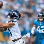 Jaxon Smith-Njigba of the Seattle Seahawks catches a touchdown pass during the second quarter against the Jacksonville Jaguars in the game at EverBank Stadium on October 12, 2025 in Jacksonville, Fla.