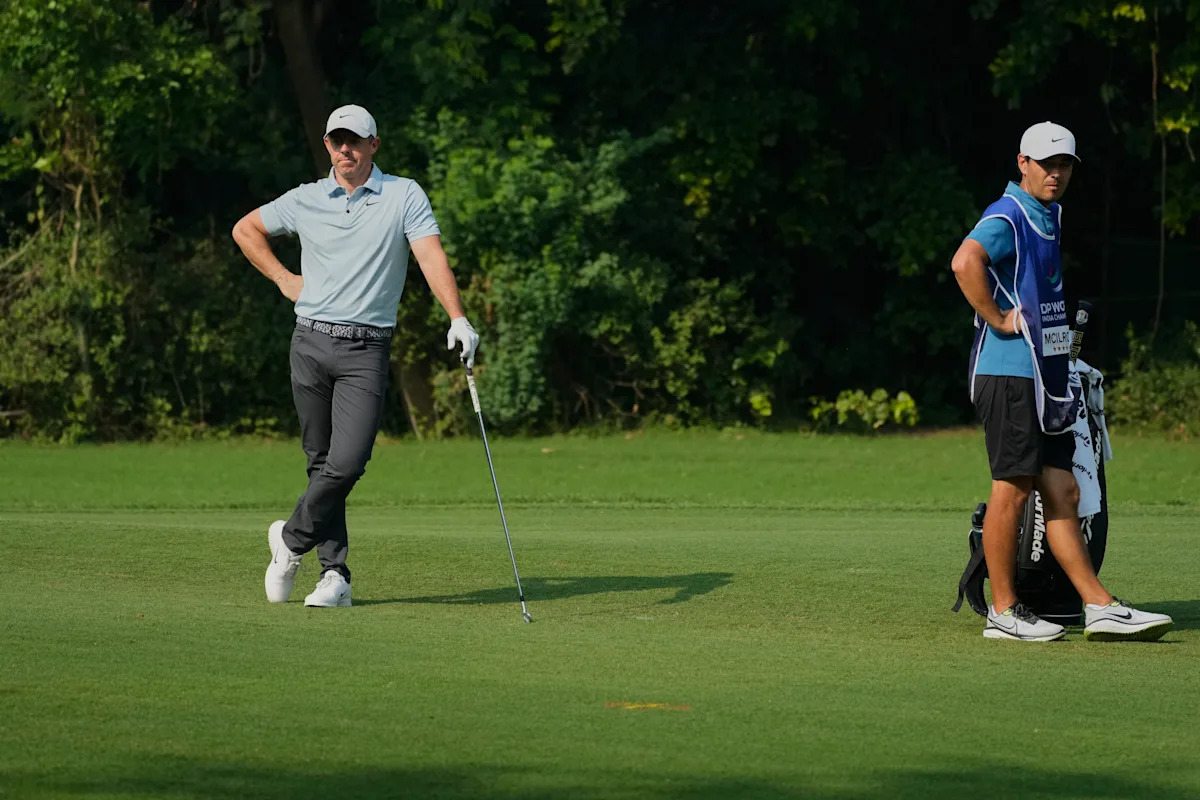 Shane Lowry leads in India with a 64, Rory McIlroy leaves driver out of the bag and shoots 69