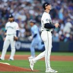 George Kirby, right, of the Seattle Mariners reacts after giving up a home run to Andrés Giménez of the Toronto Blue Jays during the third inning in game three of the American League Championship Series at T-Mobile Park on Oct. 15, 2025 in Seattle.