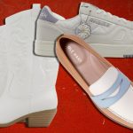 assortment of footwear like sneakers, loafers, and boots over a dark red background